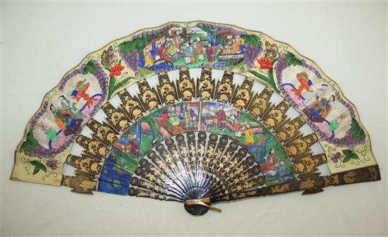 A Chinese applique work painted leaf and gilt decorated black lacquer fan, 19th century, 31cm